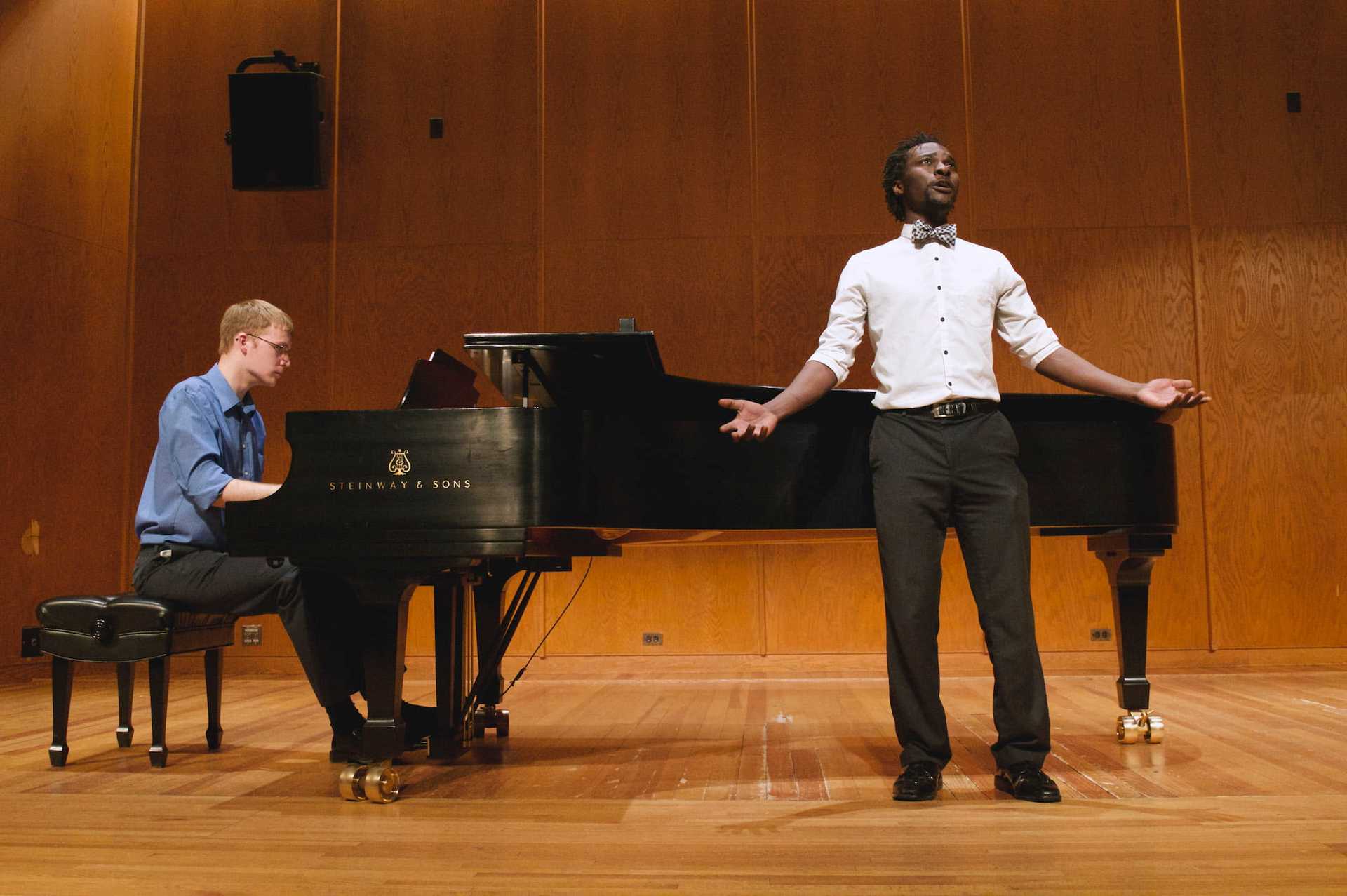 Shane McFadden at piano with singer